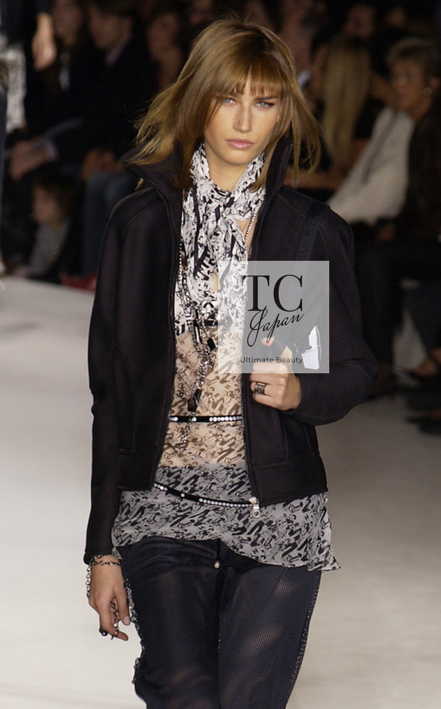 CHANEL 03S ivory black CC logo silk top on the runway